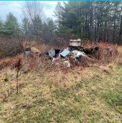 Unsightly property with scattered debris and junk